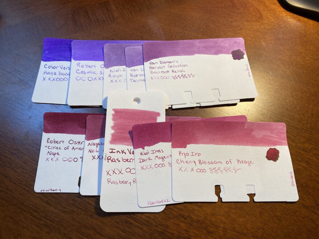 5 purple sample cards in an overlapping line on top, 5 magenta sample cards on the bottom. 