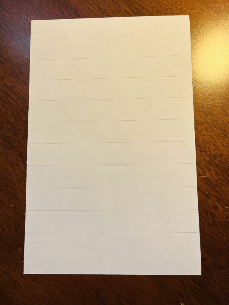 Half a sheet of paper, faint pencil lines every 2mm