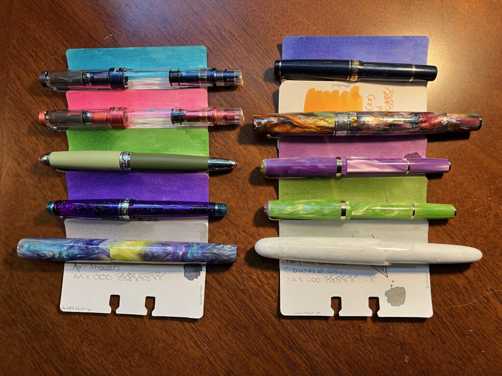 10 pens paired with 10 ink sample cards.