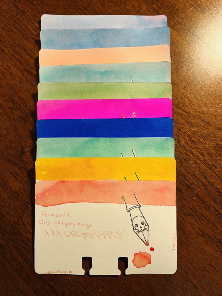 10 ink sample cards stacked on top of one another, so only the top of the card with the color swatch on it is visible on all of the cards except the bottom one. The bottom cards says “Pennonia 010 Selyempezsgo xxxooossssss 22OctVent-10 standard”