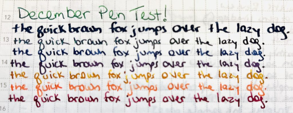 Text reads: “December Pen Test” in a green ink. And the pangram “the quick brown fox jumps over the lazy dog.” The pangram is repeated 7 times, each line is a different color. 
