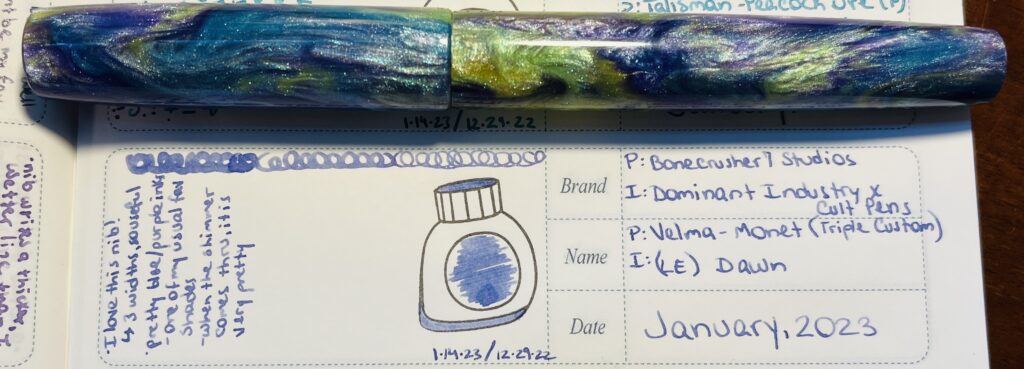 A blue/purple/yellow sparkly pen placed horizontally above an entry in a notebook listing the name of the ink and pen, a sample of the ink in an ink bottle stamp, and a brief review. 
