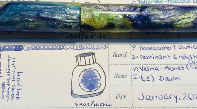 A blue/purple/yellow sparkly pen placed horizontally above an entry in a notebook listing the name of the ink and pen, a sample of the ink in an ink bottle stamp, and a brief review.